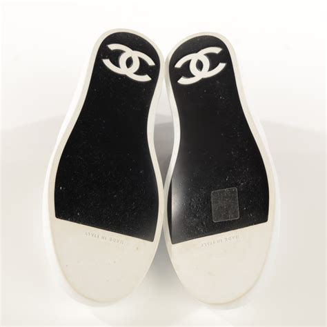 chanel black and white slip on sneakers|Chanel sneakers cost.